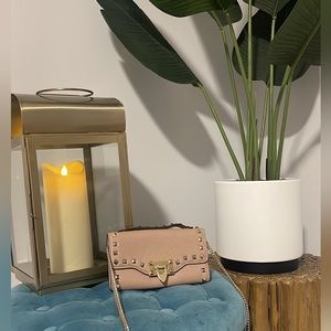 Valentino Garavani Rockstud grainy calfskin wallet with chain strap.